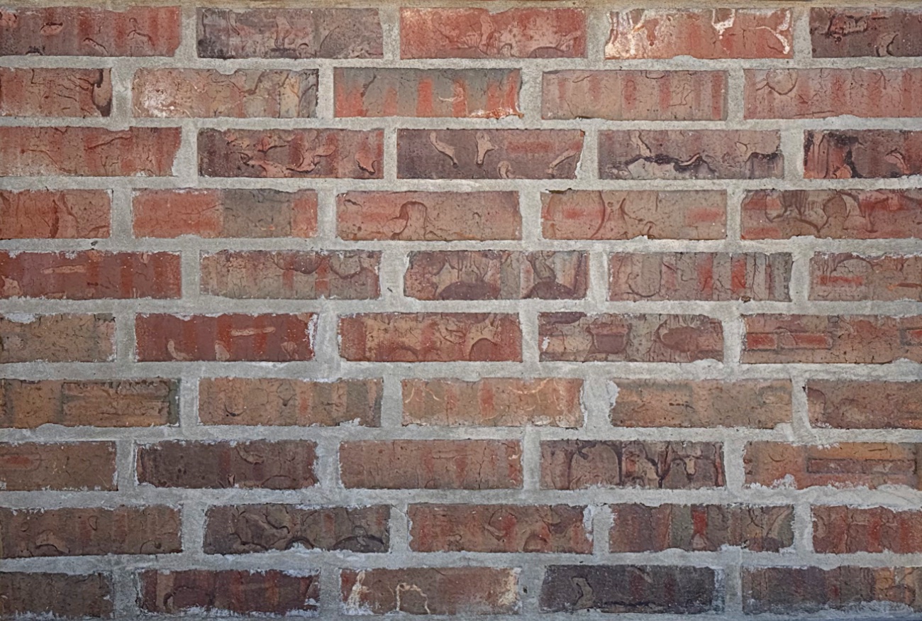 Gray mortar in the joints of a brick wall