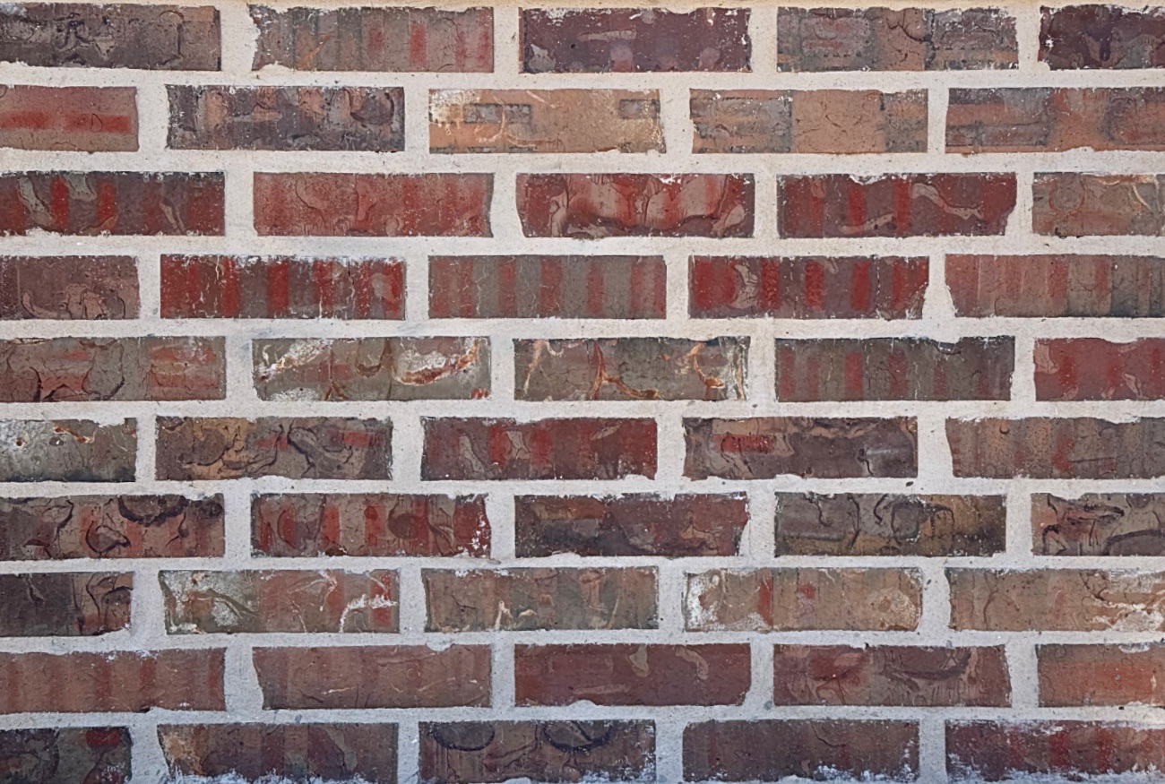 White mortar in the joints of a brick wall